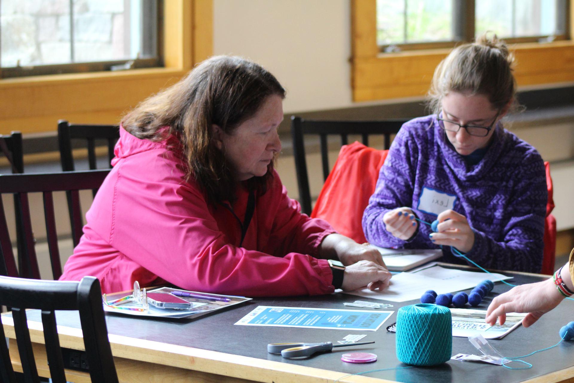 Participants engaged in a fiber arts workshop at The Wild Center. Photo courtesy of Paul Smith’s College.